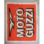 A vintage cloth advertising banner or flag for Moto guzzi motorcycles, approx 34'x 28'.