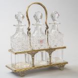 A fine silver plated decanter set early 20th century having cut glass bottles both bottles and