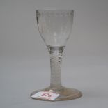 A small wine glass mid 18th century with air twist stem and central multi air twist with ribbon