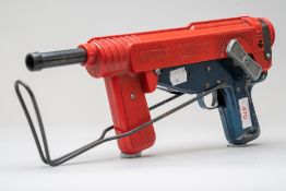 A vintage Mettoy Automatic toy gun.