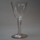 A mid 18th century wine glass with opaque twist spiral stem on plain foot
