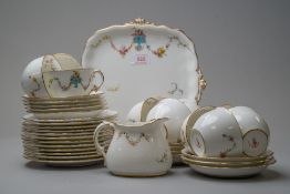 A selection of Royal Crown Derby with cups and saucers,plates and a jug, having white ground with