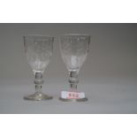 A pair of cordial glasses having decoration to bowl and fluted panels.