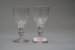 A pair of cordial glasses having decoration to bowl and fluted panels.