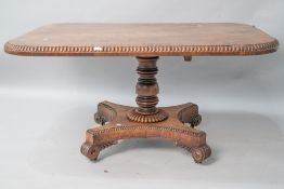 A William IV mahogany breakfast table having beaded edge, on snap hinge, turned column , platform