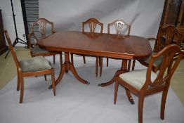 An early 1990s reproduction Regency style extending dining table , from William Bartletts