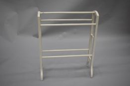 A traditional Victorian style towel rail , later painted