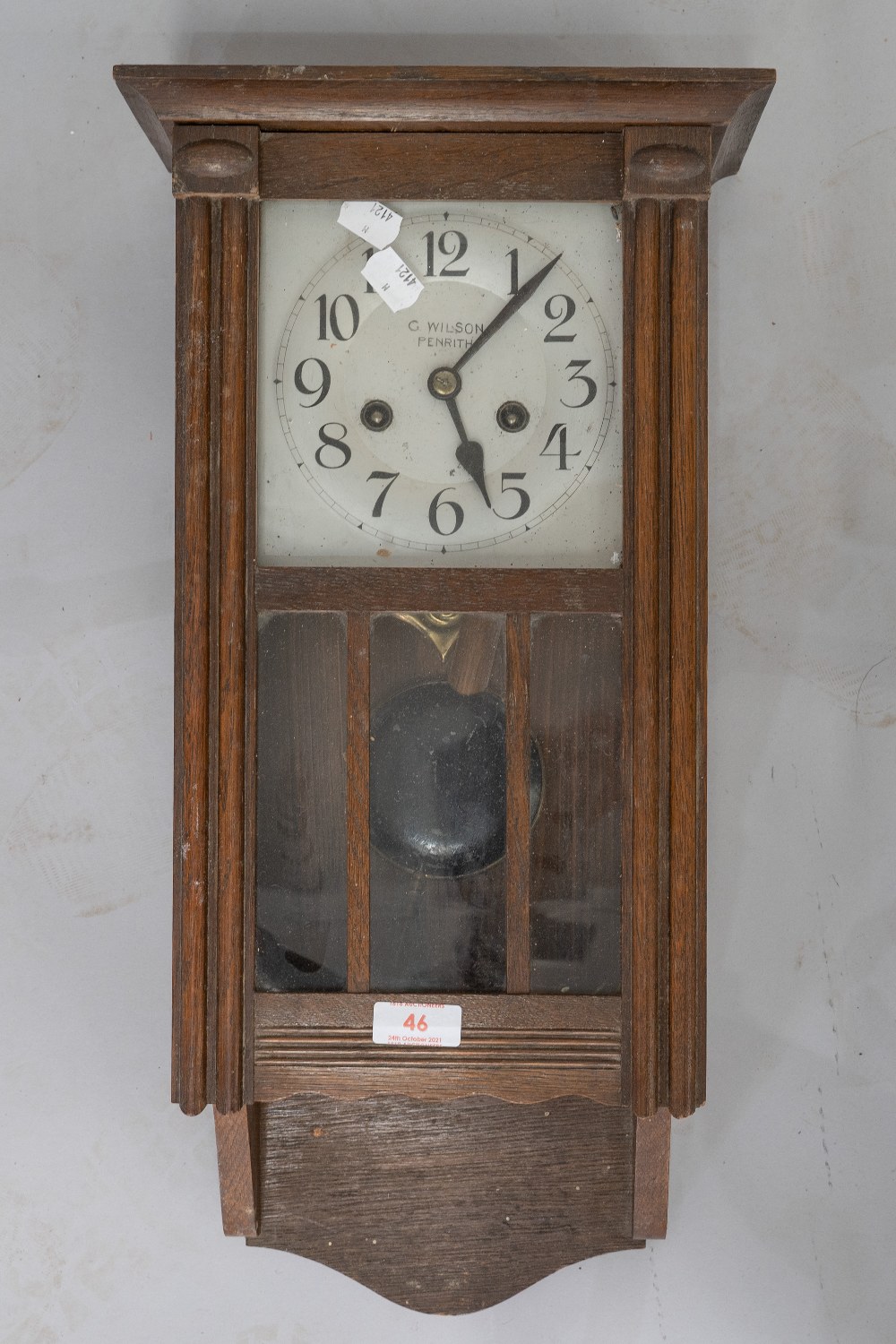 An early 20th Century oak cased wall clock, silvered dial named Wilson, Penrith, length approx.