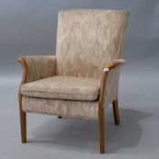 A vintage Parker Knoll beach frame upholstered low armchair