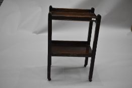 A cute early 20th Century oak tea trolley of small proportions, approx. 50 x 32cm. Some watermarks