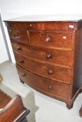 A 19th Century mahogany bow fronted chest of two over three drawers having contrasting edging to