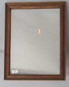 A vintage oak frame wall mirror, approx. 46 x 36cm, in good condtion with little wear to glass