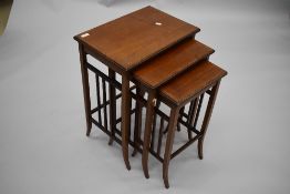 An Edwardian mahogany and inlaid trio nest of tables , having triple rail ends and tapered splay