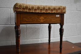 An Edwardian mahogany piano stool having classic satinwood inlay and upholstered seat, on turned