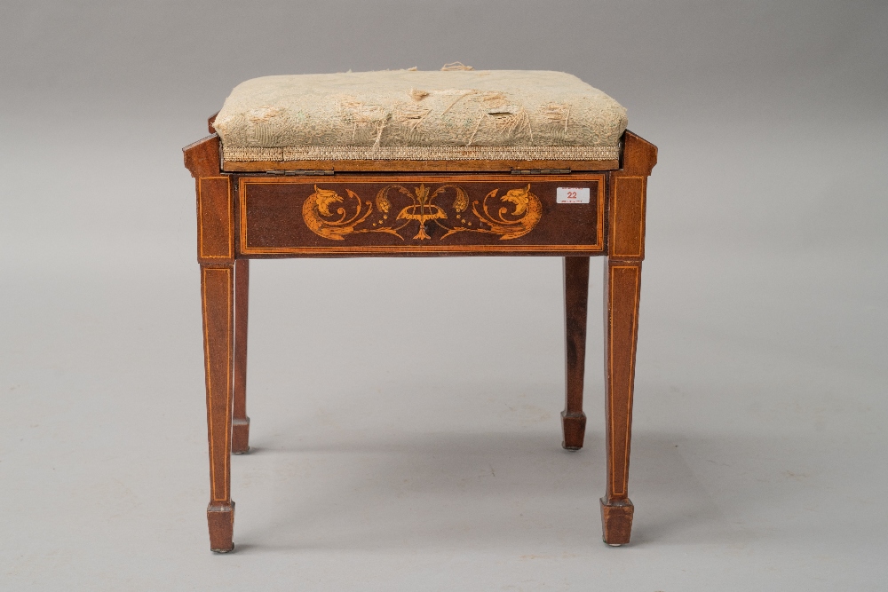 A Sheraton revival style mahogany piano stool having satinwood inlay decoration depicting mythical