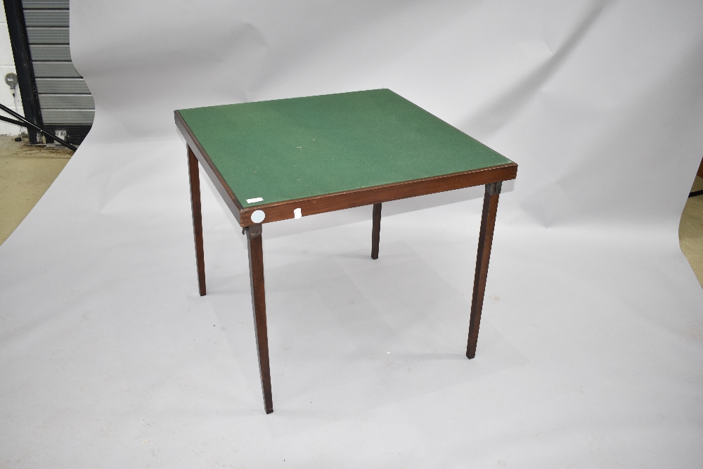 A traditional folding card table having fold in legs and green beize top, approx. 76 x 76cm, a few