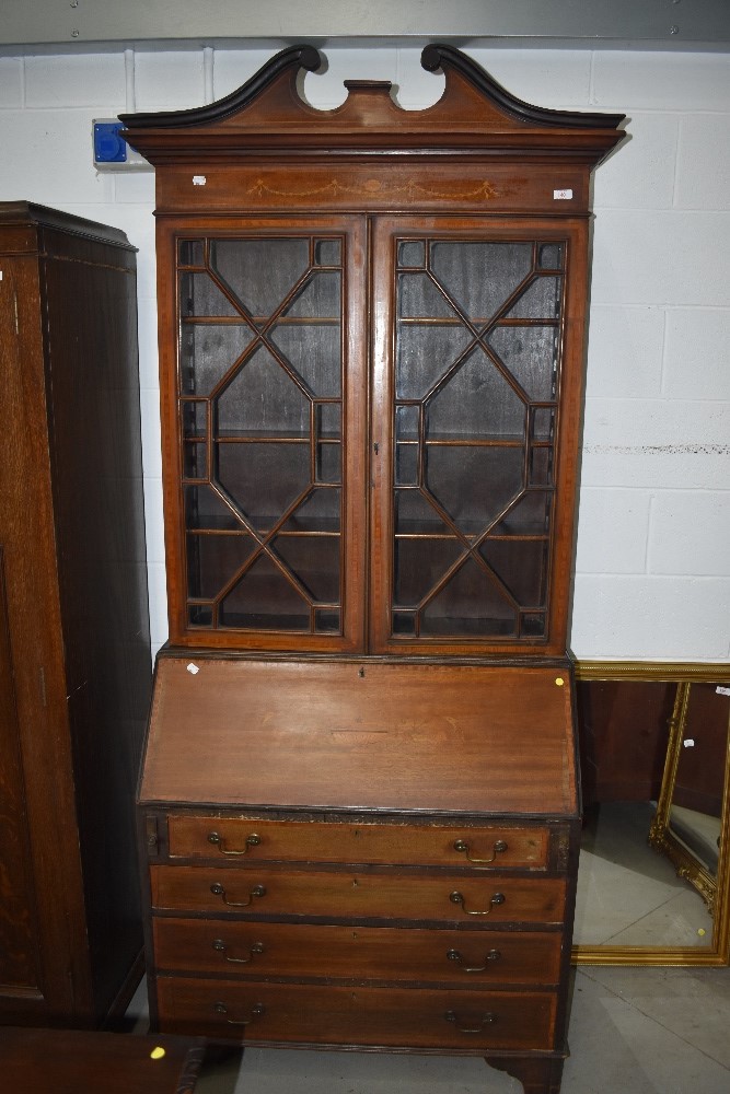 An Edwardian mahogany bureau bookcase having satinwood and other inlay decoration throughout, astral
