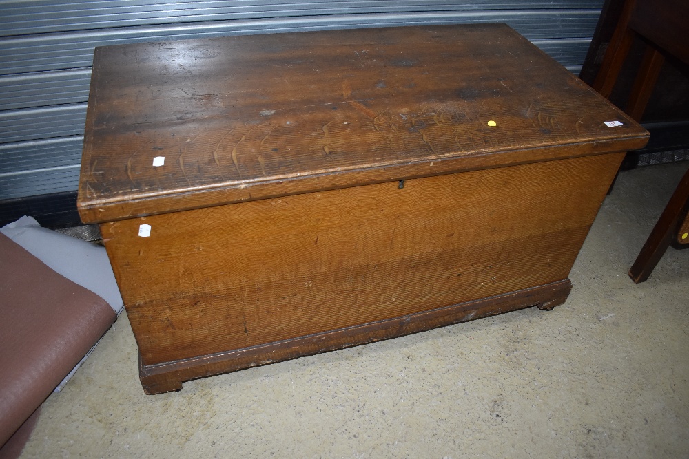 A 19th Century scumbled pine blanket box having internal candle box and double drawer, and metal