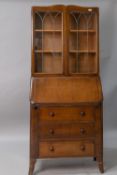 An early to mid 20th Century oak and ply bureau bookcase