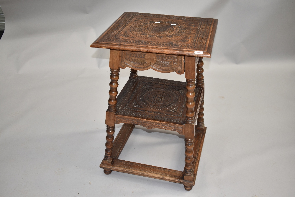 An extensively carved side or hall table table having square top and undertiert, frieze drawer
