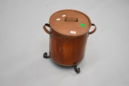 A copper coal or similar lidded bin having wrought iron fit, in the Arts and Crafts style,