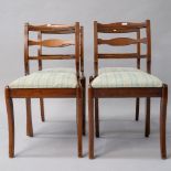 A set of four stained frame reproduction Regency style dining chairs having jade green upholstery