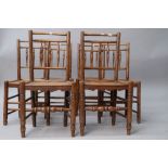 A (harlequin) set of six 19th Century spindle back chairs having solid elm seats , triple spindle to