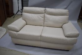 A pair of modern cream leather settees, being three and two seater, width 210 and 170cm