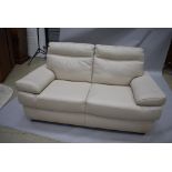 A pair of modern cream leather settees, being three and two seater, width 210 and 170cm