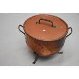 A large copper lidded cauldron , in the Arts and Crafts style, diameter approx 52cm, height 44cm