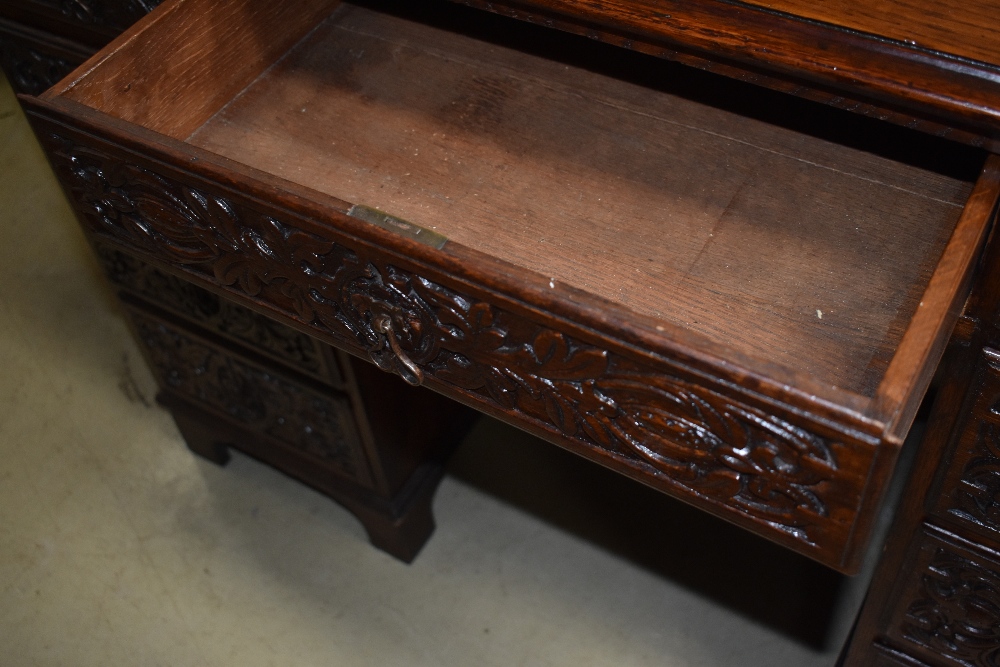 A 19th Century oak desk having extensively carved drawers, no keys but all drawers currently - Image 3 of 6