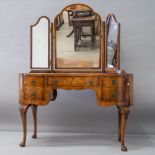 An early to mid 20th Century burr walnut dressing table , of kidney shaped design having triple