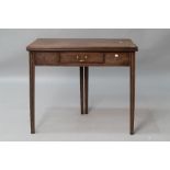 An early 19th Century mahogany fold over tea table having frieze drawer , and fluted legs, closed