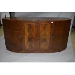 An early to mid 20th Century sapele sideboard having stepped design, with central double cupboard