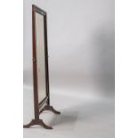 An early 20th Century mahogany and stained frame cheval mirror, of plain form, with shaped leg and