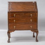 A traditional stained frame bureau , carved and cockbeaded detailing to flap , three drawers to base
