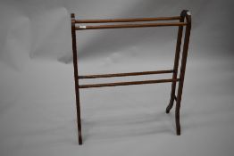 An early 20th Century mahogany towel rail