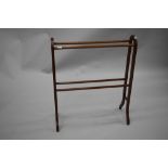 An early 20th Century mahogany towel rail