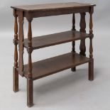 An early 20th Century oak etage/bookshelf having shaped ends and turned frame, width approx 69cm