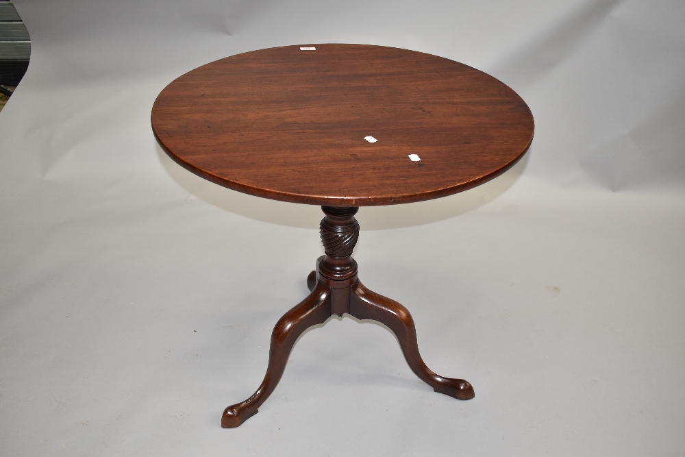 A 19th Century mahogany pedestal table having snap top on turned column and triple splay legs ,