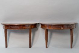 A pair of 19th Century mahogany and inlaid demi lune hall tables, front legs only, been secured to