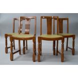 A set of four mid 20th Century oak and ply dining chairs, havingbent ply backs, lime green vinyl