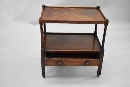 An early 20th Century oak tea trolley of large proportions with drawer to lower tier, dimensions