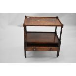 An early 20th Century oak tea trolley of large proportions with drawer to lower tier, dimensions
