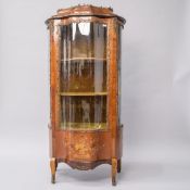 A Louis XV kingswood vitrine display cabinet having shaped glass front and side panels, typical