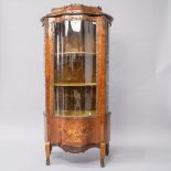 A Louis XV kingswood vitrine display cabinet having shaped glass front and side panels, typical
