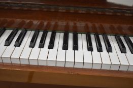 A modern upright piano , inlaid Zender, in polished mahogany case being overstrung, width approx.