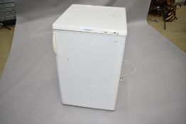 An Electrolux under counter freezer having four internal drawers. A bit tatty on the outside but