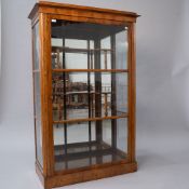An interesting late 19th or early 20th century glazed display cabinet mahogany/walnut, possibly a