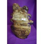 A large and imposing archaic styled Chinese soap stone lidded vessel having dragon head handles